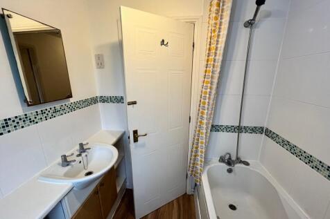 A clean and tidy bathroom featuring modern fixt...