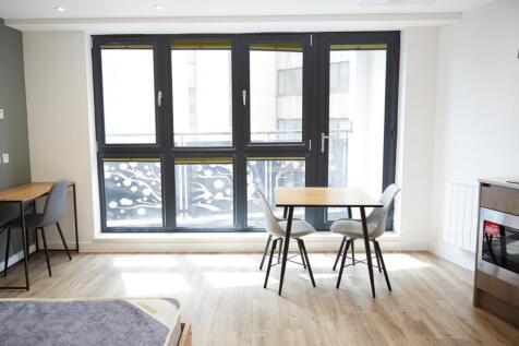 A bright and spacious modern living room with a...
