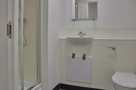 A modern bathroom featuring a sleek shower and ...