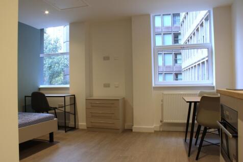 A bright and tidy double bedroom featuring ampl...
