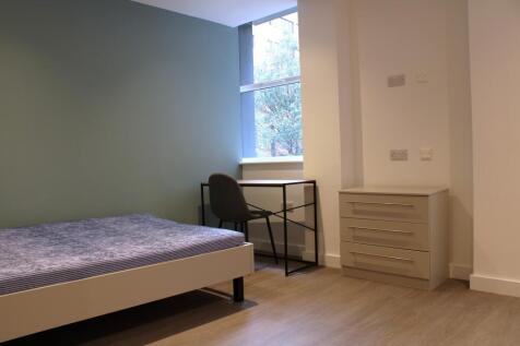 A bright and modern double bedroom featuring a ...