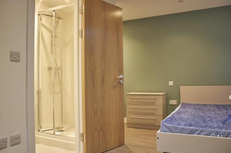 A spacious and inviting double bedroom featurin...