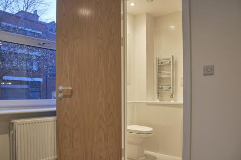 A modern and clean bathroom featuring a sleek d...