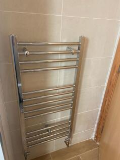 A tidy kitchenette featuring essential applianc...