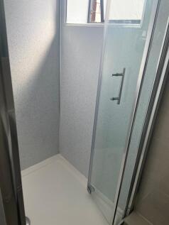 A bright and clean bathroom featuring a modern ...