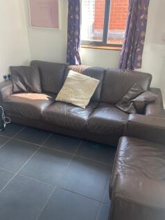A cozy living room with comfortable seating and...