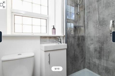 A modern and clean bathroom featuring a stylish...