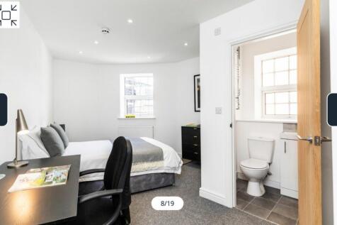 A bright and spacious double bedroom featuring ...