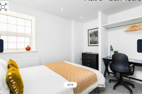 A bright and inviting double bedroom featuring ...