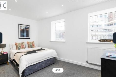 A bright and spacious double bedroom featuring ...
