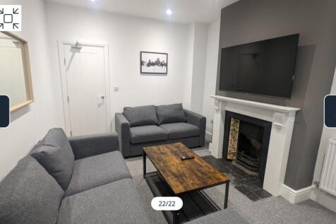 A spacious and stylish modern living room, perf...