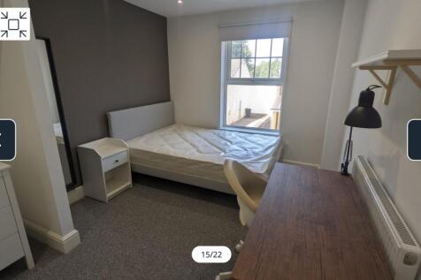 A bright and inviting double bedroom featuring ...