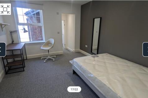 A bright and spacious double bedroom featuring ...
