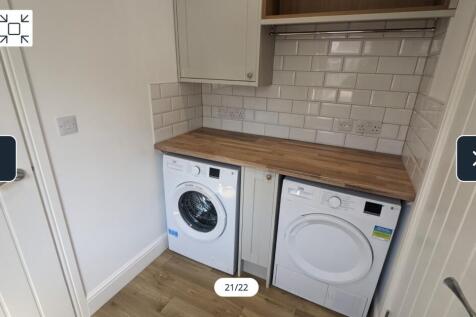 A clean and modern kitchenette with ample space...