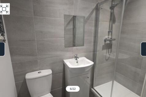 A modern and clean bathroom featuring a stylish...