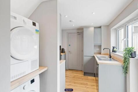 A modern and well-equipped kitchenette with amp...