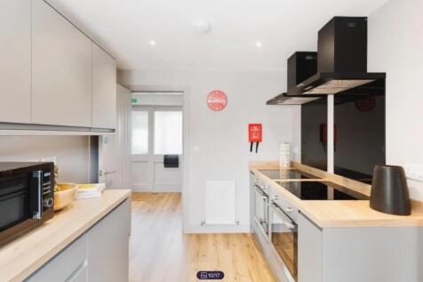 A modern and clean kitchenette featuring sleek ...