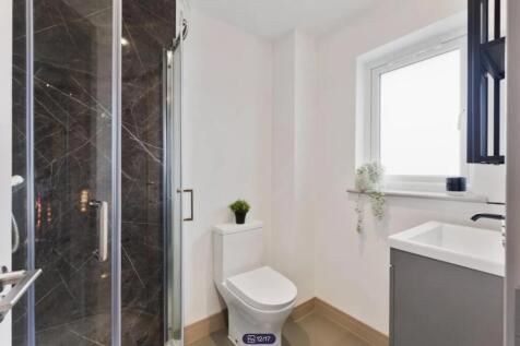 A modern and clean bathroom featuring a stylish...
