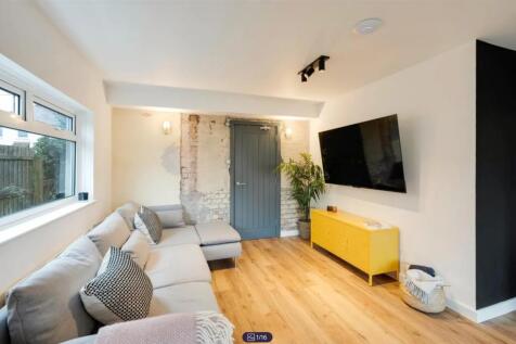 A spacious and inviting modern living room with...