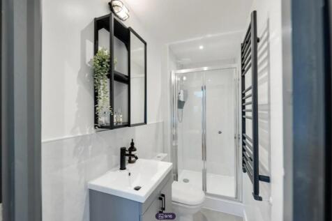 A modern and stylish bathroom featuring a sleek...
