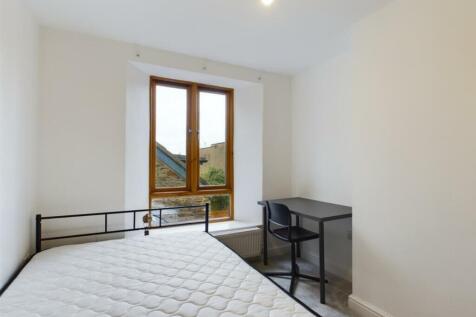 A bright and inviting double bedroom featuring ...