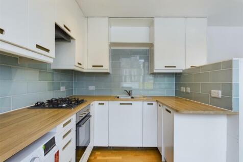 A modern and well-equipped kitchenette featurin...