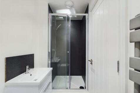 A modern and stylish bathroom featuring a sleek...