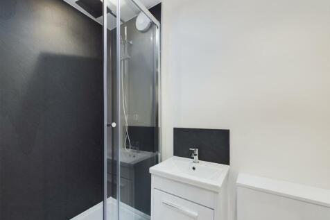 A modern and stylish bathroom featuring a sleek...