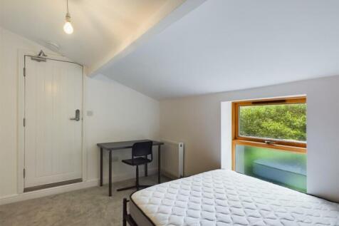 A bright and inviting double bedroom featuring ...