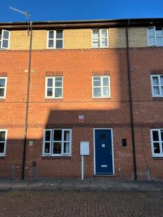 A bright and welcoming exterior view of the pro...
