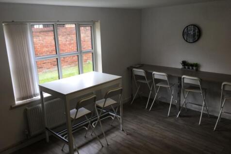 A bright and spacious living room featuring mod...