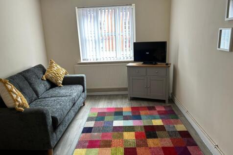 A cozy and inviting living room with a vibrant ...