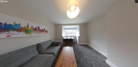 A spacious and inviting large modern living roo...