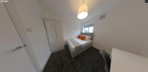 A bright and inviting double bedroom, featuring...