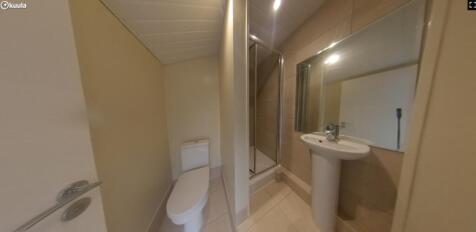 A modern and clean bathroom featuring a shower ...