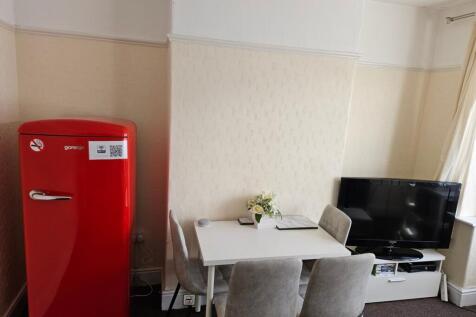 A bright and clean kitchenette featuring modern...