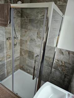 A modern and clean bathroom featuring a stylish...