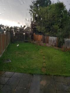 A spacious garden area with potential for outdo...