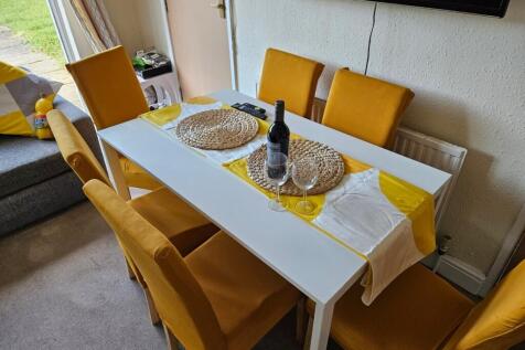 A bright and inviting large modern living room,...
