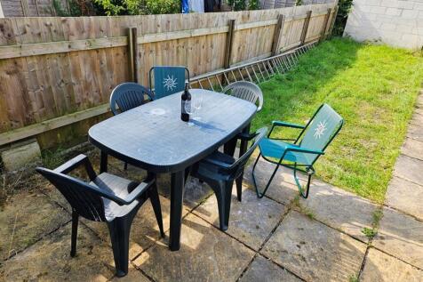 A spacious garden area perfect for outdoor gath...