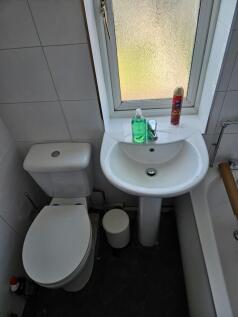 A bright and tidy bathroom featuring essential ...
