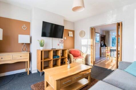 A spacious and inviting modern living room with...
