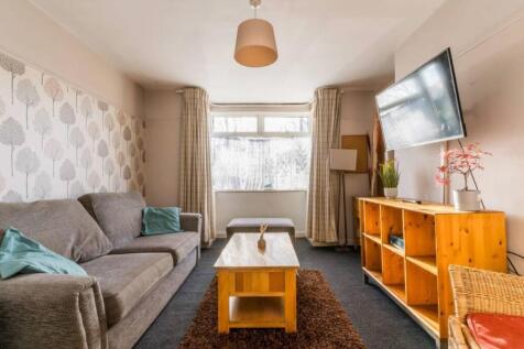A spacious and inviting modern living room perf...