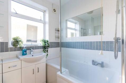 A bright and modern bathroom featuring a spacio...