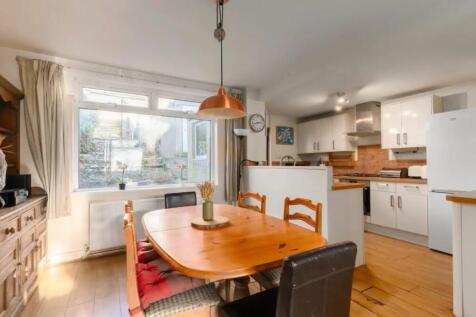 A bright and inviting kitchenette featuring a s...