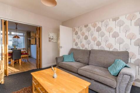 A cozy and inviting living room with a modern t...