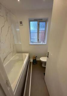 A clean and well-maintained bathroom featuring ...