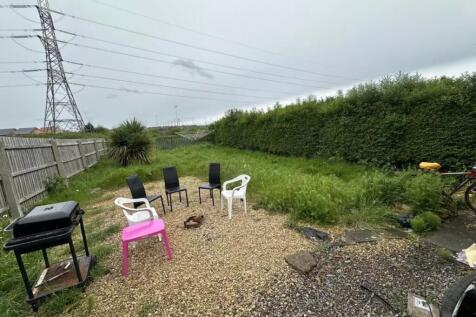 A spacious garden area with seating, perfect fo...