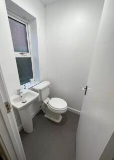 A tidy and well-maintained single toilet with n...