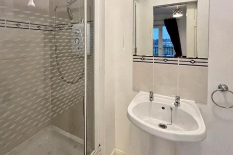 A modern and clean bathroom featuring a stylish...
